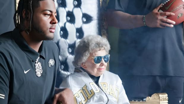 Peggy Coppom with CU lineman s a